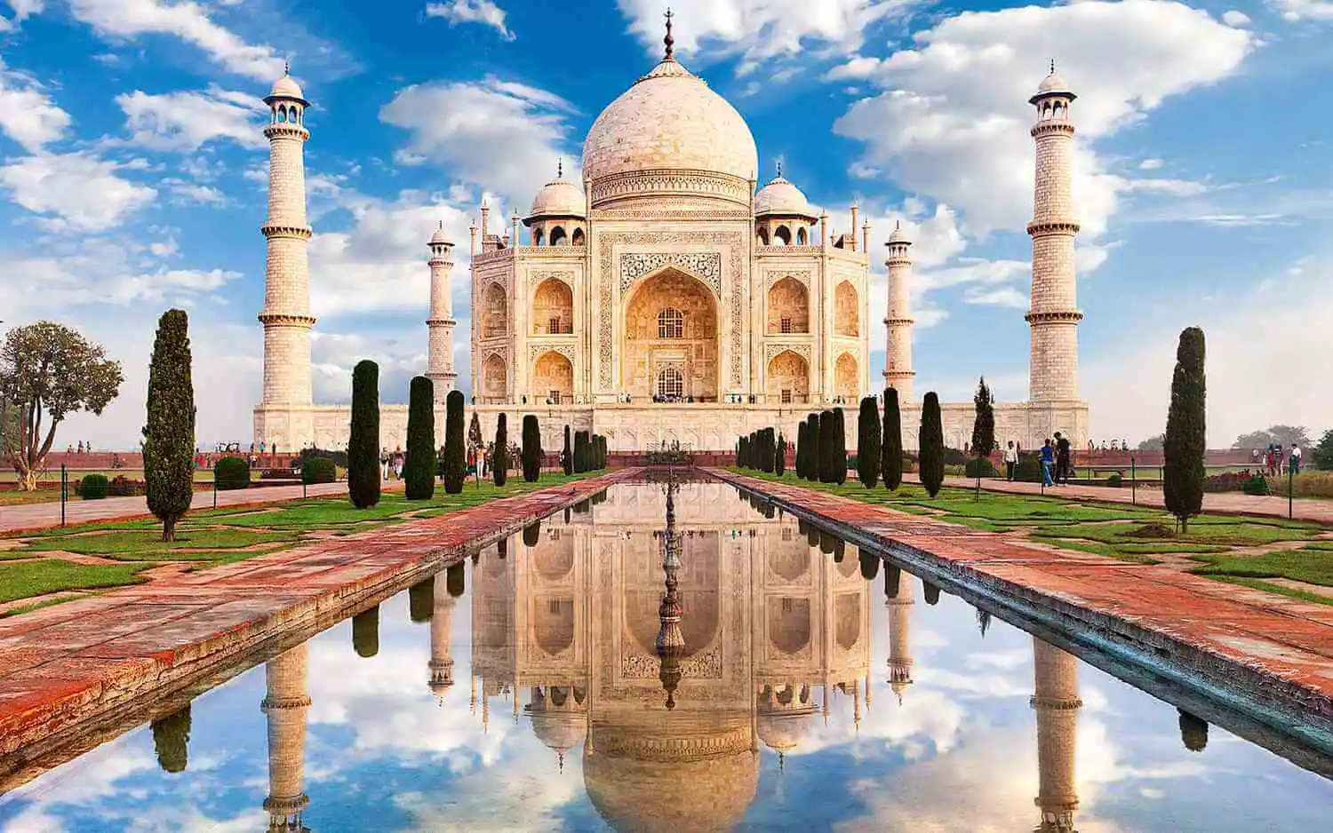 A detailed shot of the Taj Mahal's exterior, showcasing the delicate inlay work and Arabic calligraphy inscriptions, Taj Mahal - Agra India, White marble mausoleum - Taj Mahal, UNESCO World Heritage site - Taj Mahal, Indian architecture - Taj Mahal, Agra's famous landmark - Taj Mahal